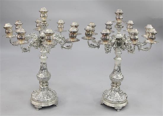 A large ornate pair of late 20th century silver plated nine light eight scroll branch candelabra, 33in.